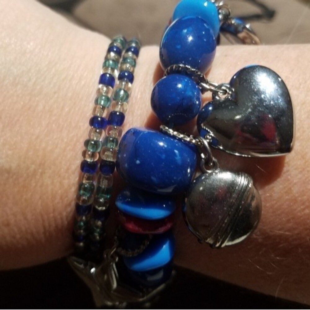 2 Beaded Bracelets, One with charms and large beads the other small beads